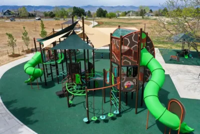The newly expanded 10-acre Toepfer Park in Highlands Ranch featuring a modern playground, nature trails, and a park shelter.